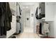 Walk-in closet with built-in shelving and rod for clothing organization leading to bathroom at 120 Mosaic Blvd # 308, Pittsboro, NC 27312
