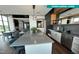 Resident clubhouse kitchen island with stainless steel appliances and stylish counter seating at 120 Mosaic Blvd # 308, Pittsboro, NC 27312