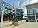 Exterior of commercial building showcasing modern design, brick accents, and inviting landscaping at 120 Mosaic Blvd # 308, Pittsboro, NC 27312