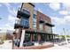 Exterior of a Hops & Berry commercial space, featuring outdoor seating, brick, and modern design at 120 Mosaic Blvd # 308, Pittsboro, NC 27312