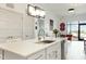 Modern kitchen with white cabinets, sleek countertops, stainless steel appliances, and an open view to the living area at 120 Mosaic Blvd # 308, Pittsboro, NC 27312