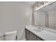 Modern bathroom featuring a sleek vanity with a quartz countertop and stylish fixtures, providing a spa-like experience at 122 Monticello Ave, Durham, NC 27707