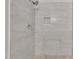 Modern shower with gray tiling, a built-in shelf, and contemporary shower head at 122 Monticello Ave, Durham, NC 27707
