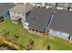 Aerial view of a home with a screened porch, a dark roof, and a neatly maintained backyard at 1237 Porters Call Dr, Wendell, NC 27591