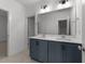 Bathroom features double sinks, large mirror, and bright lighting at 1237 Porters Call Dr, Wendell, NC 27591