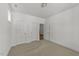 Bright bedroom with neutral carpet, white walls, closet doors, and natural light from a window at 1237 Porters Call Dr, Wendell, NC 27591