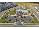 Aerial view of community pool, clubhouse, and parking highlighting the many amenities available for residents to enjoy at 1237 Porters Call Dr, Wendell, NC 27591