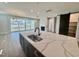 Kitchen with stone countertops, a modern island and an open layout with large sliding doors at 1237 Porters Call Dr, Wendell, NC 27591