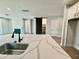 Kitchen with stone countertops, a modern island and an open layout to the living room at 1237 Porters Call Dr, Wendell, NC 27591