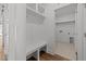 Mud room features bench with storage and access to laundry area and garage at 1237 Porters Call Dr, Wendell, NC 27591