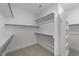 Walk-in closet features built-in shelving and ample storage space at 1237 Porters Call Dr, Wendell, NC 27591