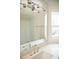 Bathroom vanity featuring chrome fixtures, subway tile backsplash, and modern lighting at 1326 Apache Ln, Apex, NC 27502