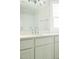 Bathroom vanity with chrome fixtures, white cabinets, and modern lighting at 1326 Apache Ln, Apex, NC 27502
