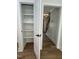 A closet provides efficient storage with several shelves inside, ready for organizing your belongings at 1326 Apache Ln, Apex, NC 27502