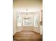 This open dining area features large windows, and an elegant chandelier at 1326 Apache Ln, Apex, NC 27502