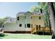 Back exterior of a two-story home with a deck and yard at 1326 Apache Ln, Apex, NC 27502