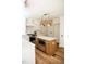 Bright kitchen with an island with microwave, white cabinets, and stainless steel appliances at 1326 Apache Ln, Apex, NC 27502