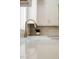 Bright renovated kitchen with white countertops, a farmhouse sink, and stainless steel appliances at 1326 Apache Ln, Apex, NC 27502