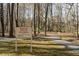 A tree-lined driveway leads into a community, marked by a sign to Shepherd's Vineyard, Private Property at 1326 Apache Ln, Apex, NC 27502
