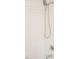 Close-up of shower features, including subway tile and handheld shower head at 1326 Apache Ln, Apex, NC 27502