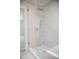 Modern shower featuring glass enclosure, white subway tile, and a hand shower at 1326 Apache Ln, Apex, NC 27502