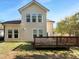 The back of house showcases a spacious deck and a lush backyard, perfect for outdoor enjoyment at 1412 Wesser Ct, Fuquay Varina, NC 27526