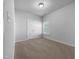 Bedroom featuring neutral carpet, white walls, closet, and window offering natural light at 1412 Wesser Ct, Fuquay Varina, NC 27526