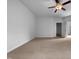 Bedroom featuring neutral carpet, ceiling fan, and access to other rooms in the home at 1412 Wesser Ct, Fuquay Varina, NC 27526