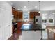 Well-equipped kitchen with stainless steel appliances, dark countertops, and ample cabinet space at 1412 Wesser Ct, Fuquay Varina, NC 27526