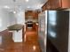 Modern kitchen featuring stainless steel appliances, dark cabinets, and an island, great for entertaining at 1412 Wesser Ct, Fuquay Varina, NC 27526
