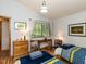 Cozy bedroom featuring twin beds, natural light, and stylish decor, perfect for relaxation at 1604 Meadow Ln, Chapel Hill, NC 27516