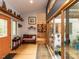 Inviting foyer with hardwood floors, bench seating, and access to a cozy courtyard at 1604 Meadow Ln, Chapel Hill, NC 27516