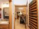 Hallway leading to living spaces, showcasing hardwood floors, wooden accents, and a bathroom at 1604 Meadow Ln, Chapel Hill, NC 27516
