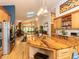 Large kitchen with wood island open to the dining room with stainless steel appliances and lots of cabinet space at 1604 Meadow Ln, Chapel Hill, NC 27516