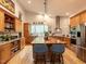 Spacious kitchen with stainless steel appliances, central island with breakfast bar, hardwood floors and ample cabinet space at 1604 Meadow Ln, Chapel Hill, NC 27516