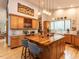 Open kitchen with central island with breakfast bar, stainless appliances and ample cabinet space at 1604 Meadow Ln, Chapel Hill, NC 27516