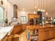 Bright kitchen with wood island, stainless appliances, white subway tile, hardwood floors, and a view to the backyard at 1604 Meadow Ln, Chapel Hill, NC 27516
