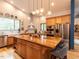 Bright kitchen with wood island, stainless appliances, hardwood floors, and a view to the backyard at 1604 Meadow Ln, Chapel Hill, NC 27516