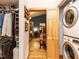 Hallway and laundry area features a stackable washer/dryer and access to the bedroom at 1604 Meadow Ln, Chapel Hill, NC 27516