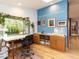 Bright studio with large window, custom desk, hardwood floors, and view to the garden at 1604 Meadow Ln, Chapel Hill, NC 27516