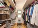 Organized walk-in closet with shelving, hanging rods, and ample storage space at 1604 Meadow Ln, Chapel Hill, NC 27516