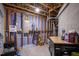 Unfinished basement with visible framing, utility lines, and storage solutions at 184 Wildfell Trl, Cary, NC 27513