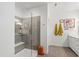 Modern bathroom featuring a glass shower with a built-in bench and neutral walls at 184 Wildfell Trl, Cary, NC 27513
