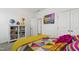 Charming bedroom featuring a playful accent wall and colorful decor, offering a cozy, inviting atmosphere at 184 Wildfell Trl, Cary, NC 27513