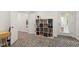 Cozy, neutral colored room featuring a bookshelf and an exit to a patio at 184 Wildfell Trl, Cary, NC 27513