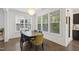 Dining area featuring natural light, a wooden table, and comfortable upholstered chairs at 184 Wildfell Trl, Cary, NC 27513