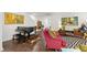 Cozy living room featuring hardwood floors, stylish furniture, and ample natural light at 184 Wildfell Trl, Cary, NC 27513