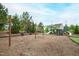 Community playground with swings, slides, and climbing structure, adjacent to residential buildings at 184 Wildfell Trl, Cary, NC 27513