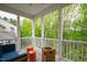 Charming screened-in porch featuring a cozy seating area with bright views of the outdoor scenery at 184 Wildfell Trl, Cary, NC 27513
