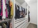 Organized walk-in closet featuring built-in shelving and ample hanging space for clothing and accessories at 184 Wildfell Trl, Cary, NC 27513